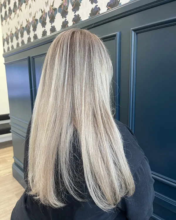 Straight ash blonde hair with bright dimensional highlights by Aprille at Novum Hair Studio